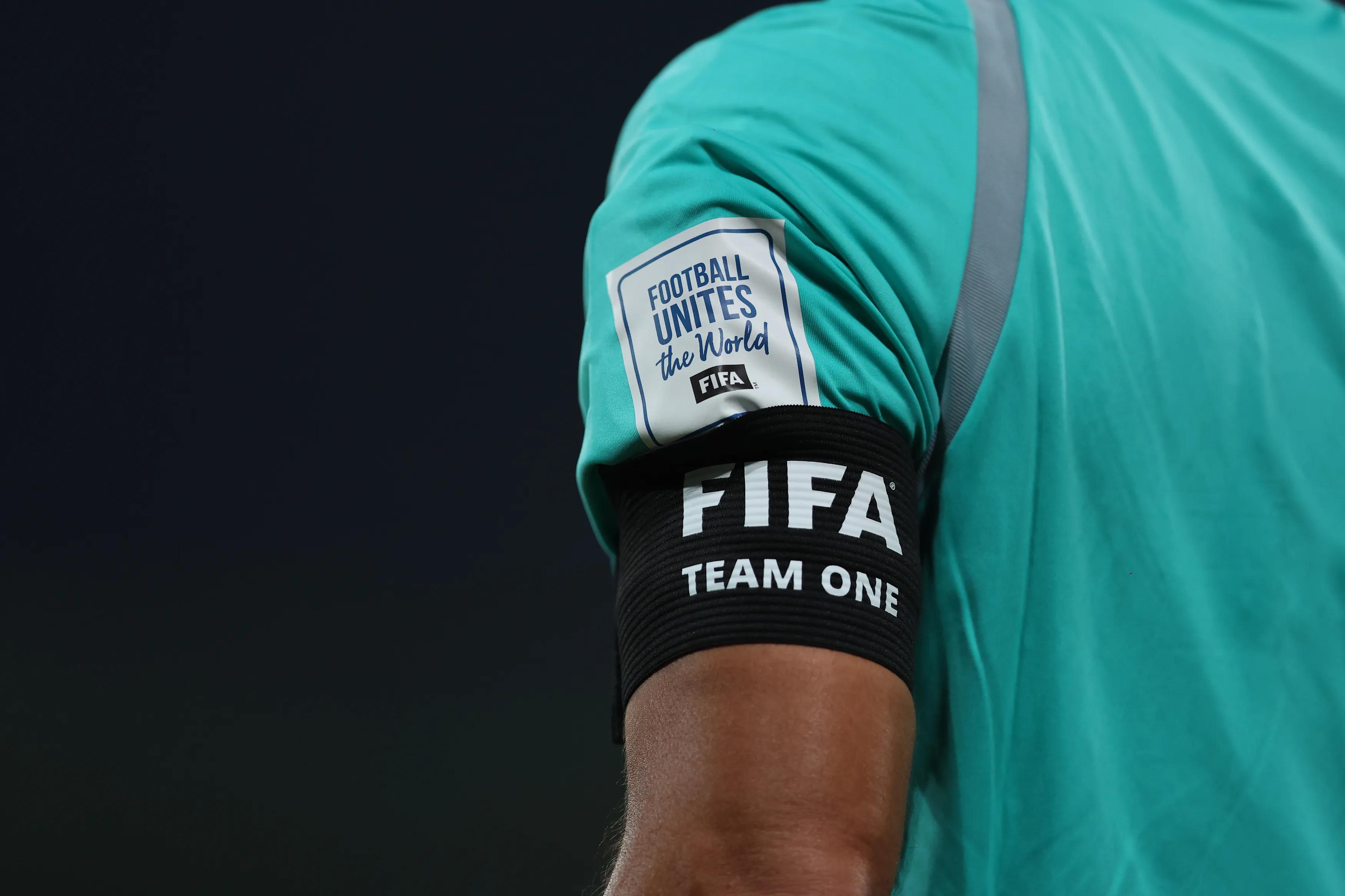 DOHA, QATAR - NOVEMBER 14: A detailed view of the 'FIFA Team One' black armband, seen worn by a match official during the FIFA Under-17 World Cup Round of 32 match between Switzerland and Egypt at Aspire Zone on November 14, 2025 in Doha, Qatar.  (Photo by Mohamed Farag - FIFA/FIFA via Getty Images)